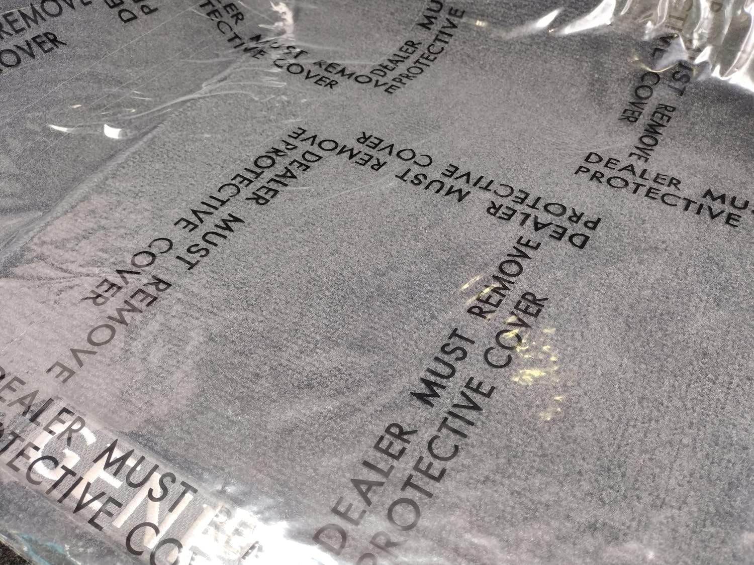 Adhesive Plastic Dealer Must Remove Car Floor Mats (4 MIL / 24 in x 600 FT ROLL)